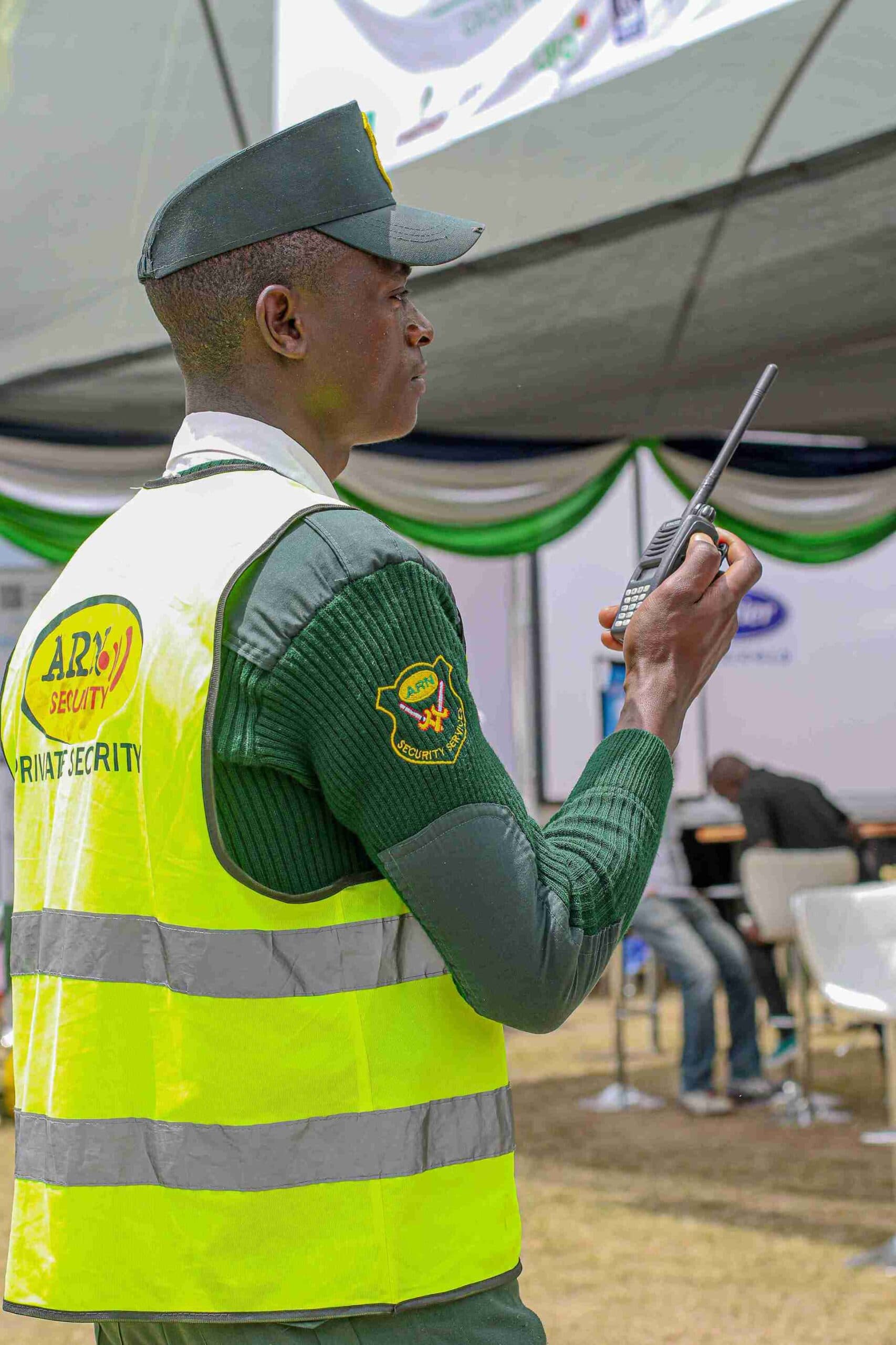ARN Security Consultants and Training Services LTD guard using a radio during field operations